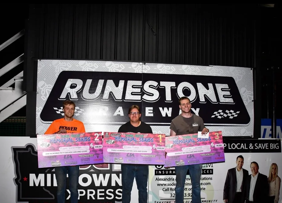 podium with winners and their check prizes